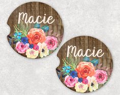 two coasters with flowers and the word'macie'written on them, against a wooden background