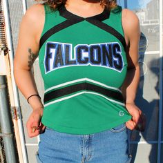 Vintage falcons cheer top. Cute day time look with denim or a body con midi skirt.  *Matching skirt available upon request* Label: -- Fits like: XS/S.  Excellent Vintage Condition | No Notable Flaws Measurements (laid flat & unstretched) : Sleeve: 2.5 in Bust: 16 in  (double this) Waist: 14 in (double this) Length: 19 in Fitted Tops For Cheerleading With School Spirit, 90s Style Cotton Top For Game Day, School Spirit Stretch Tops For Cheerleading, Fitted Green Tops For College, Fitted Tops For Cheerleading In Spring, 90s Style Tops For Game Day And Sports Season, 90s Style Tops For Game Day During Sports Season, Cotton Stretch Tops With Team Spirit Style, Stretch Cotton Tops With Team Spirit Style