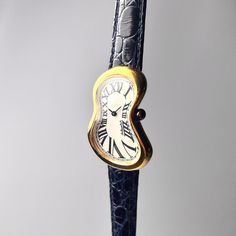 "1990s salvador dali softwatch \" The Disintegration of the persistence of memory \" Authentic designed from Salvador Dali museum 🤍White dial/ Gold Case 💙Original leather strap 💛Melting Buckle 🤍Celluloid crystal ✅Fine Working conditions Authentic from salvador dali museum Good conditions Dimension Case 🔽 High 38mm x width 24 mm Conditions 90% Because it is a watch that is almost 20+years old Have some minor scratches on case and crystal in vintage piece From old owner but still in working c Melting Watch, The Persistence Of Memory, Salvador Dali Museum, Dali Museum, Salvador Dali, Gold Case, White Dial, Dali, Jaeger Watch