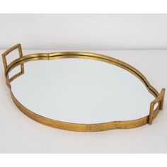 an oval brass tray with two handles