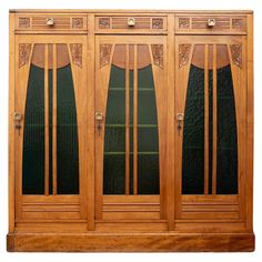 a wooden cabinet with glass doors on the front and side panels, in an ornate manner