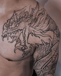 a man with a dragon tattoo on his chest