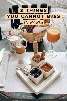 a table with food and drinks on it that says 8 things you cannot miss in paris