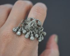 Substantial old tribal high grade silver  ring from Rajasthan. Three bunches of bell tassels are  attached to the ornate silver band. For more info & purchase check cosmicnorbu.com Measurements are: Size: 8.5 Weight: 14gr. This ring ships registered priority and with tracking ❀ Please read my shop and return policies before purchasing ❀ https://www.etsy.com/shop/CosmicNorbu/policy?ref=shopinfo_policies_leftnav Traditional Antique Silver Ring Jewelry, Traditional Silver Metal Rings, Traditional Antique Silver Ring, Big Rings Indian, Vintage Oxidized Rings For Collectors, Rajasthani Silver Jewellery, Bohemian Antique Silver Bangle For Festivals, Vintage Oxidized Bangle For Festival, Traditional Silver Jewelry With Bells