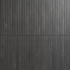 an image of a black wall with vertical lines on it