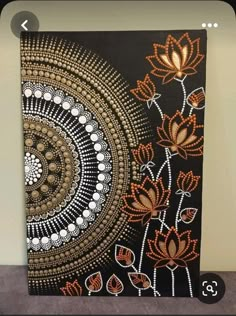 an abstract painting with orange and white flowers on black background, in the middle of a room