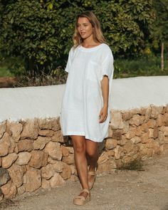 "Oversized linen T-shirt dress MIJAS in white is the epitome of comfort. Inspired by the silhouette of boyfriend's T-Shirt it brings to life the concept of looking good & feeling good. Linen fabric allows your skin to breathe, therefore you will feel fresh on warm days. The style of this linen dress is so versatile that you can keep reinventing your looks. Wear this dress on its own with sneakers or sandals, or pair it with wide linen pants or longer shorts - you will be surprised how easy it is Tshirt Dress Outfits, Tunic Dresses Outfit, Oversized Tshirt Dress, Wide Linen Pants, Linen Tunics For Women, Boyfriend Tshirt, Wrinkled Clothes, Linen Tshirts, T Shirt Oversize