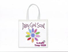 a white bag with the words daisy girl scout on it's front and back