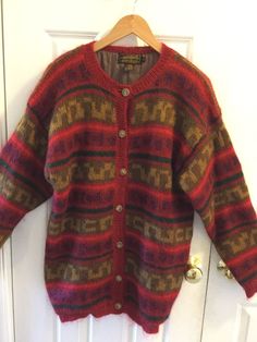 Very good to excellent condition...absolutely beautiful.  Silky soft.  Lining is made of nylon.  Armpit to armpit..21.5 inches.  .shoulder to hem....29'inches Red Wool Cardigan For Fall, Vintage Red Sweater For Winter, Red Vintage Sweater For Winter, Vintage Red Fall Sweater, Cozy Red Wool Outerwear, Red Autumn, Red Sweaters, Eddie Bauer, Cardigan Sweater