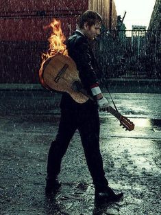 a man is walking in the rain with an open fire pack on his back while he carries something