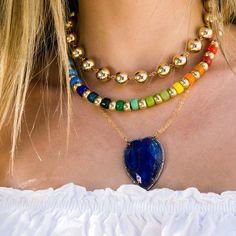 "Bright, vibrant glass beads make this necklace perfect addition to your summer sundress or a white blouse. Colorful glass beads and gold plated silver beads slide along gold filled chain that is finished with gold filled clasp and extender . Alone or layered with your favorites, this necklace exudes a playful, eclectic bohemian elegance. Necklace: 15\" plus an extender PLEASE NOTICE: This listing is only for rainbow choker, other necklaces pictured are for ideas only and available at my shop. L Gold Beaded Chain For Summer, Gold Jewelry With Colorful Beads For Summer, Beach Jewelry With Large Glass Beads, Gold Necklaces With Gold Beads For Summer, Multicolor Gold Beads Jewelry For Summer, Multicolor Gold Beaded Jewelry For Summer, Multicolor Gold Beaded Summer Jewelry, Gold Jewelry With Gemstone Beads For Summer, Vibrant Rainbow Jewelry For Beach