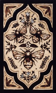 an intricately designed tile with bees and leaves on the border, in black and white