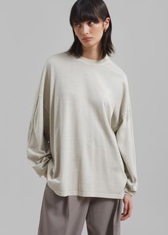 Color: Beige Lightweight cotton fleece Relaxed fit Crew neckline Long sleeves Drop shoulders Slip on style Unlined 100% Cotton Machine Wash Cold By The Frankie Shop. Imported Long Sleeve Relaxed Fit T-shirt For Loungewear, Oversized T-shirt With Ribbed Cuffs For Loungewear, Long Sleeve Tops With Ribbed Neckline And Relaxed Fit, Relaxed Long Sleeve Tops, Relaxed Long Sleeve T-shirt For Spring, Oversized Cotton Long Sleeve Top For Everyday, Relaxed Fit Long Sleeve Tops For Loungewear, Relaxed Long Sleeve Spring T-shirt, Relaxed Fit Sporty Tops For Layering