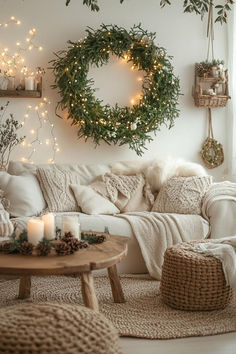 a living room filled with lots of furniture and christmas wreath on the wall above it