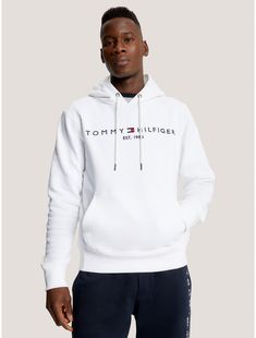 Tommy Hilfiger men's hoodie. Made from soft, brushed-back fleece with a flat, clean face and smooth handfeel, our regular-fit Tommy logo hoodie is just as comfortable as it is cool.  Material: 70% Better Cotton Initiative (bci) Cotton, 30% Polyester - Conventional. White Long Sleeve Hoodie With Logo, White Logo Hoodie For Fall, White Logo Hoodie For Streetwear, White Hooded Logo Sweatshirt, White Logo Hooded Sweatshirt, White Hooded Sweatshirt With Logo, White Sporty Logo Hoodie, White Sporty Hoodie With Logo, Tommy Hilfiger Sporty Hoodie For Streetwear