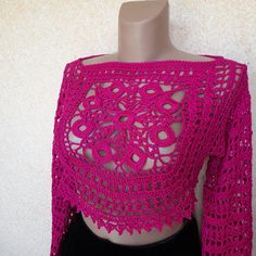 A fuchsia crochet mesh top sounds like a bold and stylish choice! The vibrant color will definitely make a statement, and the crochet mesh adds a fun, textured element to your outfit.  A granny square with a Celtic-inspired weave combined with a delicate mesh pattern and a cute border definitely makes for a unique and eye-catching top. The intricate design and attention to detail will certainly set it apart from more conventional garments. This is the perfect layering piece which completely transforms any look. This is something really special and original! The sleeves of this sweater are long and can cover your arms. Size  M-L, sleeve length 26 inches. Handmade with 100% high quality cotton yarn. Мade in a room free from tobacco smoke. Original design by NatalyDStudio. Care Instructions H Fitted Long Sleeve Crochet Lace Crop Top, Stretch Crochet Top In Pink, Stretch Pink Crochet Top, Pink Crochet Crop Top For Festival, Fitted Pink Crochet Top With Open Knit, Pink Fitted Crochet Top With Open Knit, Pink Fitted Crochet Top, Pink Fitted Open Knit Crochet Top, Fitted Open Knit Crochet Top For Festivals