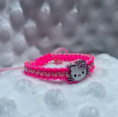 Hello Kitty Braided Friendship Bracelets Pink Adjustable Themed Charm Bracelet, Pink Themed Adjustable Charm Bracelet, Adjustable Pink Themed Charm Bracelet, Hello Kitty Adjustable Jewelry For Gifts, Adjustable Hello Kitty Jewelry As Gift, Adjustable Hello Kitty Jewelry Gift, Pink Themed Bracelet As Gift, Themed Pink Bracelets As A Gift, Themed Pink Bracelet Gift