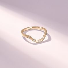 The Curved Wedding Band for Women is a timeless and elegant choice for those seeking a beautiful and versatile ring. Available in 10k, 14k, or 18k solid gold, you can choose between yellow, rose, or white gold to match your style. Features * Made to Order. * Gold KT: 14K Solid Gold * Custom Gold Color: Yellow Gold, White Gold, Rose Gold * Moissanite Color-Clarity: D-E-F color VVS Clarity * Total CTW: 0.05 ctw * Width of Band: 1.80MM * Thickness of Band: 1.19MM * Ready to Ship in 5-7 Business Day Engagement Ring Enhancer, Green Engagement Rings, Engagement Ring Enhancers, Curved Wedding Ring, Beaded Stacking Rings, Contour Ring, Ring Enhancer, Gold Rings Stackable, Pave Diamond Ring