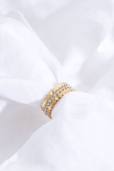 Meet our Triple Stacking Gold Ring Set – three individual rings that come together as a set. Wear them alone or let them perfectly fit together.   Each ring is real 18k gold-plated and features scalloped edges. One of the three rings features sparkly cubic zirconia stones.  Waterproof, sweat-proof and life proof! All our jewellery is made of the highest quality recycled materials and are free from nickel and brass, so won't ever tarnish, rust or turn your skin green!  All Ballinger pieces are ma Fine Jewelry Ring With Fluted Bezel, Elegant 14k Gold Jewelry With Fluted Bezel, Fine Jewelry With Fluted Bezel In 14k Gold, Diamond Jewelry With Fluted Bezel As Gift, Gold Promise Ring With Fluted Bezel, Elegant Yellow Gold Jewelry With Fluted Bezel, Gold Jewelry With Fluted Bezel For Gift, Elegant Gold Rings With Fluted Bezel, Gold Rings With Fluted Bezel Fine Jewelry