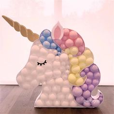 a sculpture of a unicorn made out of balloons