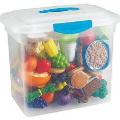 a plastic container filled with lots of different types of toys and food in it's lid