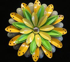 Welcome Spring with this cheery yellow and green four tiered Flower Power Brooch. Enameled in a pale fern, bright yellow, kelly green and pale yellow with a shiny gold tone glossy center. Measures 3" in diameter, mint condition. Very coooooooooooooool! Green Spring Brooches As Gifts, Spring Green Brooch Gift, Green Spring Brooches Perfect As A Gift, Green Spring Gift Brooches, Vintage Yellow Flower Brooch, Welcome Spring, Yellow And Green, Pale Yellow, Kelly Green