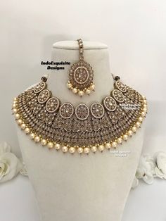 Antique Polki Necklace Set comes with earrings and tikka / Bridal necklace Set/ High Quality Kundan and Polki Jewelry/Wedding Jewelry/Antique dull gold necklace set All items are shipped from Brampton, Ontario, Canada. If you need your item by a certain day, please reach out to us for express delivery option before placing the order so that we can update the shipping for you. Standard shipping/delivery timeline Below are the delivery timeline estimates after the order is dispatched. ---> USA delivery timeline * 4-8 business days to major urban centers in USA. It may take 2-3 days extra to remote locations ---> Canada delivery timeline  * 2-3 business days - GTA  & Montreal  * 2-4  business days - Rest of Ontario/Quebec * 4-8 business days-  Rest of Canada    ---> Europe/Middle East timelin Silver Bridal Necklace With Zari Work For Wedding, Bollywood Style Jewelry Sets For Reception, Hand Set Round Bridal Necklace Bollywood Style, Bollywood Jewelry Sets For Diwali Reception, Bollywood Chandbali Jewelry Sets For Reception, Bollywood Style Meenakari Jewelry Sets For Reception, Silver Kundan Necklace With Zari Work For Reception, Silver Bridal Necklace With Zari Work, Bollywood Bridal Necklace With Round Stone Work