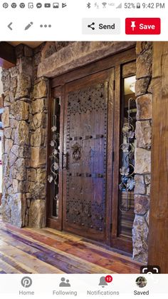 a large wooden door sitting inside of a stone building