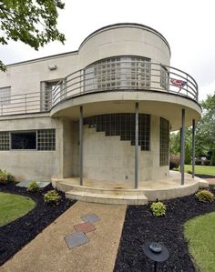 a circular house with stairs leading up to it