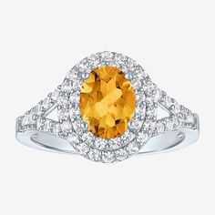 an oval shaped yellow sapphire and diamond ring