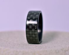 Each ring comes in a nice gift box with free priority mail shipping. This minimalist ultralight carbon fiber ring is made by 100% real carbon fiber woven in a plain pattern. It is handmade and is trimmed, sanded and high polished to gloss finish enhances the unique look and interesting design of the fibers.  Inspired by cycling and racing industry the ring is high-tech and luxury. This carbon fiber ring is not only incredibly durable and light but it has one of the highest strength to weight rat Boys Cross Necklace, Carbon Fiber Ring, Pisces Necklace, Taurus Necklace, Carbon Fiber Rings, Christian Necklace, Modern Bracelets, Stainless Steel Chain Necklace, Fiber Jewelry