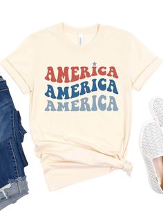 Looking for the perfect way to show off your love for America? Look no further than our America America America Patriotic T-shirt! Featuring a bold retro font in red and blue, this shirt is sure to make a statement. Made from high-quality Bella + Canvas cotton blend fabric, this shirt is both comfortable and durable. Available in six different colors, you can choose the perfect shade to suit your personal style. And with sizes ranging from XS to XXXL, this shirt is sure to fit everyone. Each shi Retro Font, Show Off, Jersey Shorts, Suits You, Women Collection, Fabric Care, Bella Canvas, Red And Blue, Short Sleeve Tee