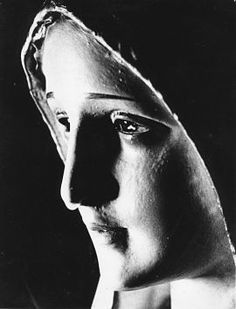 a black and white photo of a woman's face