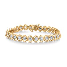 This beautiful tennis bracelet will add a dazzling measure of classic glamour to any ensemble, sure to become a cherished go-to staple of your jewelry collection. Crafted in 10k yellow gold, this bezel set diamond bracelet fastens with a box clasp, and features 32 glimmering round diamonds. The diamonds are 3ctw, I in color, and I2 in clarity. The bracelet measures 7.25 inches in length and .29 inches in width. Fine Jewelry Tennis Bracelet With Channel Set For Wedding, Elegant Channel Set Tennis Bracelet For Anniversary, Elegant Wedding Tennis Bracelet With Channel Set, Classic Diamond Bracelet With Channel Set, Timeless Channel Set Tennis Bracelet For Anniversary, Elegant Channel Set Tennis Bracelet For Weddings, Classic Round Cut Channel Set Diamond Bracelet, Elegant Formal Channel Set Tennis Bracelet, Classic Channel Set Tennis Bracelet For Anniversary