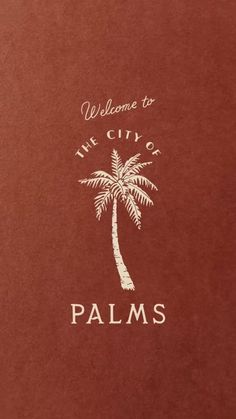 the palm tree is in front of the sign for the city of palms, which reads welcome to the city