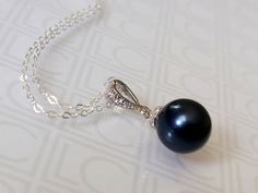 Dark Blue Navy Blue Colored Pearl Drop Silver Pendant Necklace with .925 Sterling Silver Chain. PLEASE READ ITEM DESCRIPTION and SHOP POLICIES before placing your order, and contact me with any questions! CHAIN is 18 inches (45.7cm) long. PENDANT is about 0.86 inch (2.2cm) long including bail. MATCHING EARRINGS: https://www.etsy.com/listing/266058103/navy-blue-pearl-earrings-dark-blue-pearl?click_key=18557cdb6347e9e280bafbe421ebf49ab2d4ffc2%3A266058103&click_sum=64a132e6&ref=shop_home_active_4&c Elegant Royal Blue Necklace For Party, Elegant Royal Blue Party Necklace, Blue Round Pendant Necklace For Formal Occasions, Elegant Blue Round Pendant Necklace, Elegant Blue Pearl Necklace For Formal Occasions, Formal Blue Round Pendant Necklace, Elegant Blue Necklace For Anniversary, Elegant Blue Round Pearl Necklace, Elegant Blue Bridal Necklace