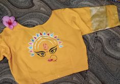 Hand painted durga ma yellow blouse. Material : cotton silk Uses and purpose : wedding and party wear Care and uses : machin washeblale Yellow Cotton Choli For Puja, Yellow Choli With Motifs For Puja, Cotton Blouse With Motifs For Navratri, Cotton Blouse Piece With Kalamkari Print For Festivals, Festive Yellow Kalamkari Blouse Piece, Yellow Cotton Choli For Diwali, Cotton Block Print Blouse Piece For Festivals, Yellow Cotton Blouse Piece For Puja, Yellow Zari Work Top For Navratri