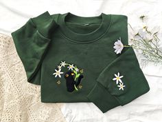 This sweatshirt is made of high quality cotton weave, advanced embroidery technology to ensure bright colors and detailed patterns, unisex and soft and comfortable. Sweatshirt makes for an edgy, casual style. Each sweatshirt has a unique aesthetic, and is a gift that will not go out of style for your own family, friends, or teachers. Size We offer a variety of colors and different sizes, you can choose your favorite and size, we recommend that you use the size of the potential better fit or loos Cat Design Cotton Long Sleeve Sweatshirt, Casual Cotton Sweatshirt With Cat Design, Cotton Crew Neck Sweater With Cat Design, Cotton Crew Neck Sweatshirt With Cat Design, Green Embroidered Crew Neck Hoodie, Casual Green Sweatshirt With Embroidery, Green Long Sleeve Sweatshirt With Machine Embroidery, Edgy Casual Style, Stone Island Badge