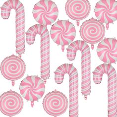 pink and white striped lollipops are arranged in rows