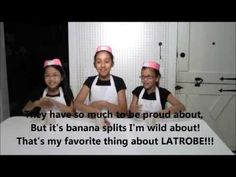 three girls in aprons are standing behind a table with a sign that says, they have so much to be proud about