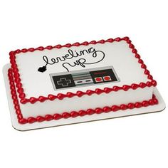 a cake that is decorated with an old school video game controller and the words someone up on it