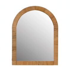 an arched wooden mirror is shown against a white background with the reflection of it's natural wood frame