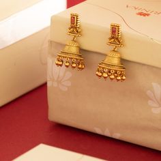 Description: Amp up your accessories style with these antique gold-tone jhumka earrings from Tarinika. These earrings are a fantastic way to elevate any outfit. Style this simple earring with the modern ethnic outfit. Details & Specifications: Materials used: Brass Alloy with Antique platingWeight – Earring-19 gmLength – Earring-4.5 cmMake it customWant to make it a custom earring? Sure! Reach out to us at support@tarinika.com and we’ll be happy to make possible modifications at no extra cost. F Luxury Gold Jhumkas, Cheap Gold Chandbalis For Wedding, Luxury Designer Jhumkas For Diwali, Gold Earring Ideas, Wedding Jhumkas Bridal Jewelry, Bohemian Cheap Jhumkas For Diwali, Luxury Temple Jewelry Jhumkas, Luxury 22k Gold Ceremonial Earrings, Luxury Traditional Jhumkas