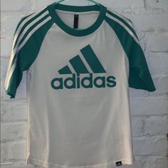 Cut The Tag In Hopes That I’d Wear This But Never Got Around To It. Sleeve Comes To Just Above Allow. Can Fit A Small. It’s A Turquoise Color Green Adidas Tops With Logo, Casual Green Adidas Logo T-shirt, Casual Green Adidas Logo Top, Casual Green Top With Adidas Logo, Green Adidas Logo Crew Neck Top, Adidas Green Top For Spring, Green Adidas Top For Spring, Green Casual Top With Three Stripes, Casual Green Top With Three Stripes