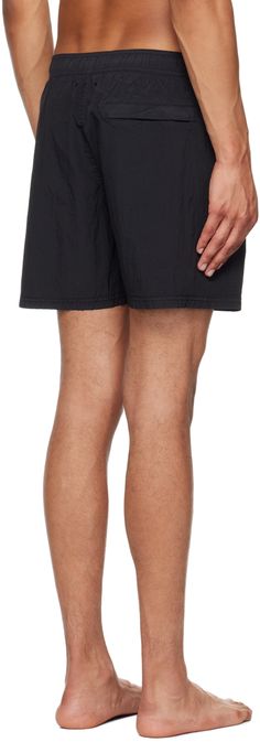 Crinkled ECONYL® regenerated nylon taffeta swim shorts. · Concealed drawstring at elasticized waistband · Three-pocket styling · Logo patch at front · Briefs-style nylon mesh lining Supplier color: Black Supplier code: 8115B0943 Nylon Beachwear Bottoms With Side Pockets, Beachwear Nylon Bottoms With Side Pockets, Relaxed Fit Nylon Swim Trunks With Side Pockets, Nylon Swim Trunks With Drawstring And Relaxed Fit, Relaxed Fit Nylon Swim Trunks With Drawstring, Black Nylon Swim Trunks With Drawstring, Nylon Drawstring Shorts For Streetwear, Streetwear Nylon Drawstring Shorts, Beachwear Nylon Bottoms With Functional Drawstring