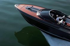 a black and brown boat in the water