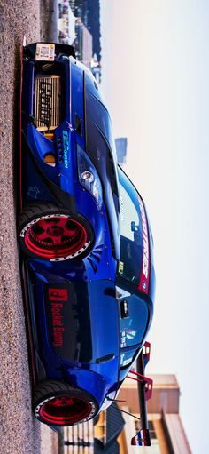 the rear end of a blue sports car