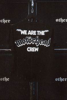 we are the motorcycle crew t - shirt hanging up