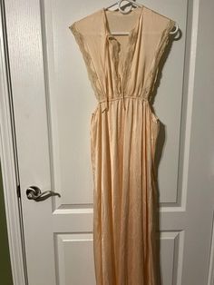 Absolutely gorgeous gown, these pictures do not do it justice. It does have a couple tiny blue marks around the neck line that I have not tried to get out. Vintage V-neck Nightgown For Spring, Vintage Pink Long Sleeve Sleepwear, Pink V-neck Nightgown, Casual Pink V-neck Nightgown, Peach Lace, Vintage Pink V-neck Nightgown, Womens Pajamas, Pale Peach, Lace Lingerie