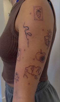 a woman's arm with tattoos on it, including fruit and vegetables in black ink